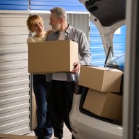 Woman and male working in self storage unit